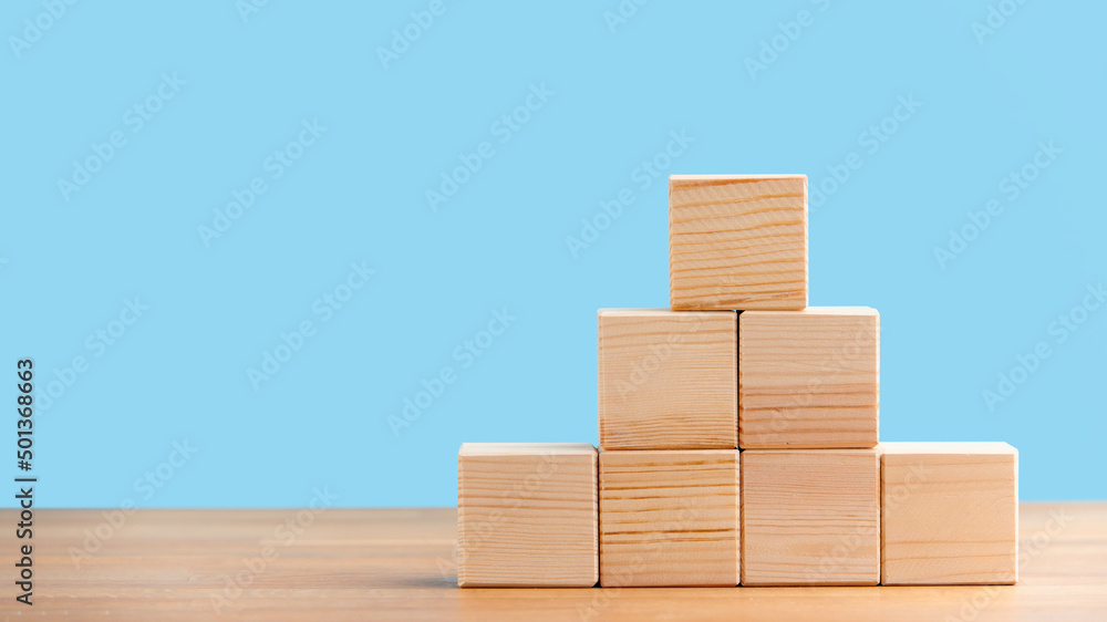 Blank wooden block cubes on a blue background for your text. free space for business concept template and banner.. Blank wooden block cubes on a blue background for your text. free space for business concept template and banner..
