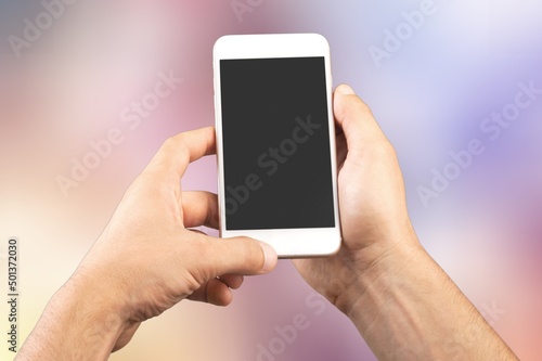 Hand holds phone Sample social media app interface on mobile phone showing shared video content