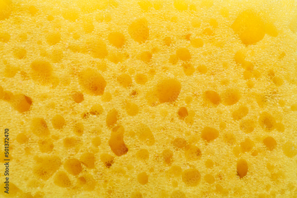 Yellow cleaning sponge as background, top view Yellow cleaning sponge as background, top view