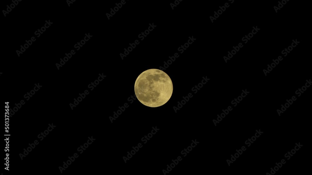 Full moon in the dark night sky in summer with no clouds Full moon in the dark night sky in summer with no clouds