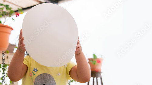 balloon in front of face