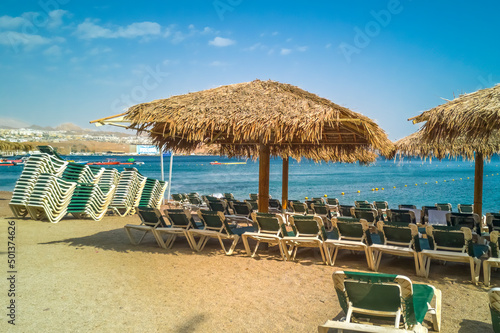 Concept of blessing and happy vacation. Relaxing public beach of the Red Sea, Middle East 