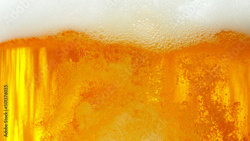 Macro photo of bubbling beer, closeup.