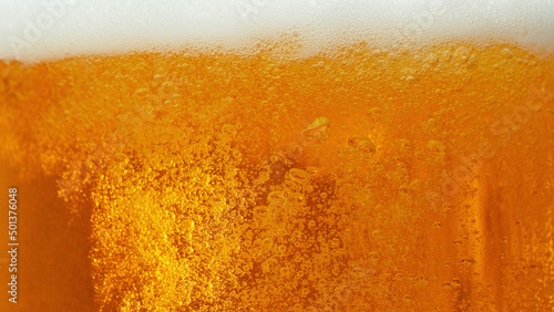 Macro photo of bubbling beer, closeup.