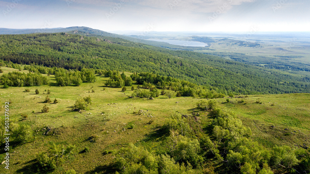 Southern Urals in spring. Ural Mountains, Irendyk ridge. Aerial view.