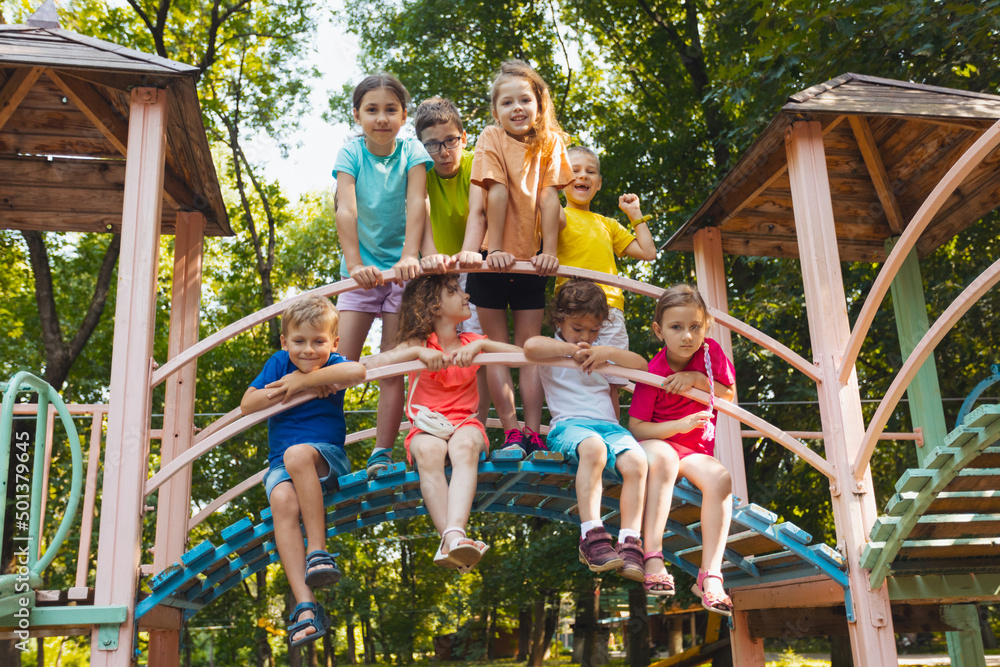 © oksix - The little kids in the playground are showing thumbs up
