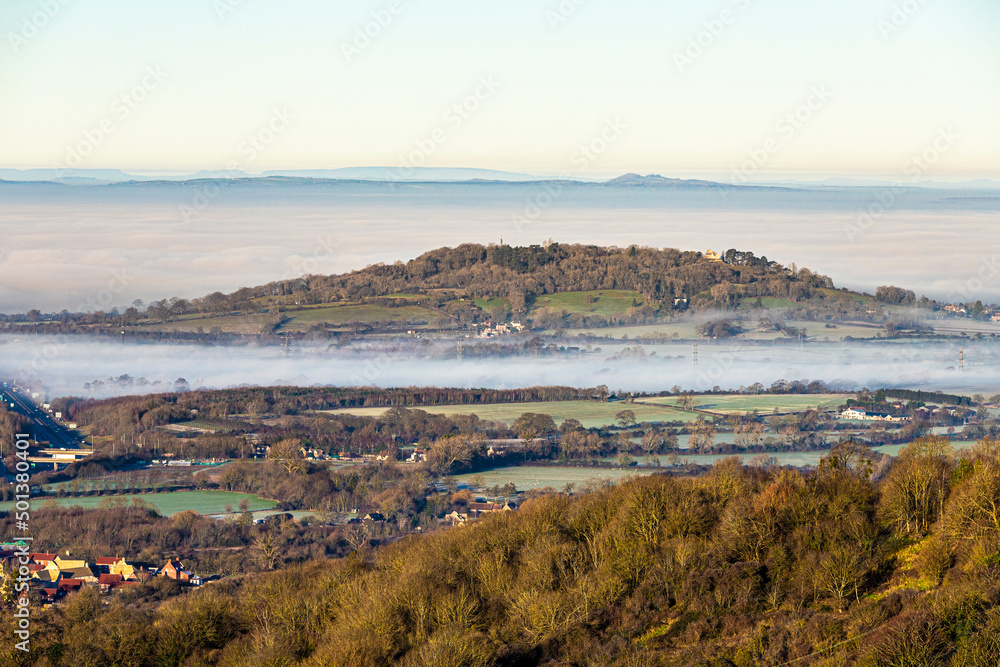 A temperature inversion causing fog to obscure the Vale of Gloucester, England UK. Churchdown Hill (Chosen Hill) is standing clear.