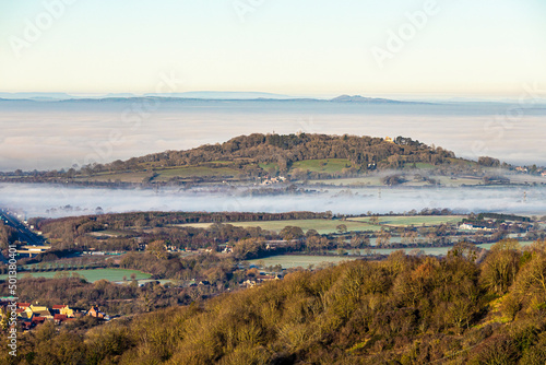 A temperature inversion causing fog to obscure the Vale of Gloucester, England UK. Churchdown Hill (Chosen Hill) is standing clear.