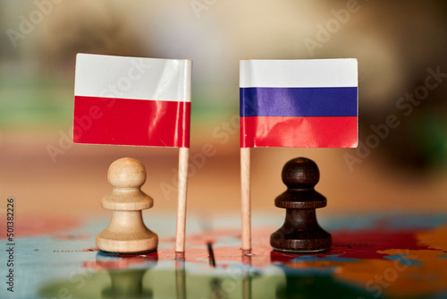 Closeup shot of tje Polish and Russian flag photo