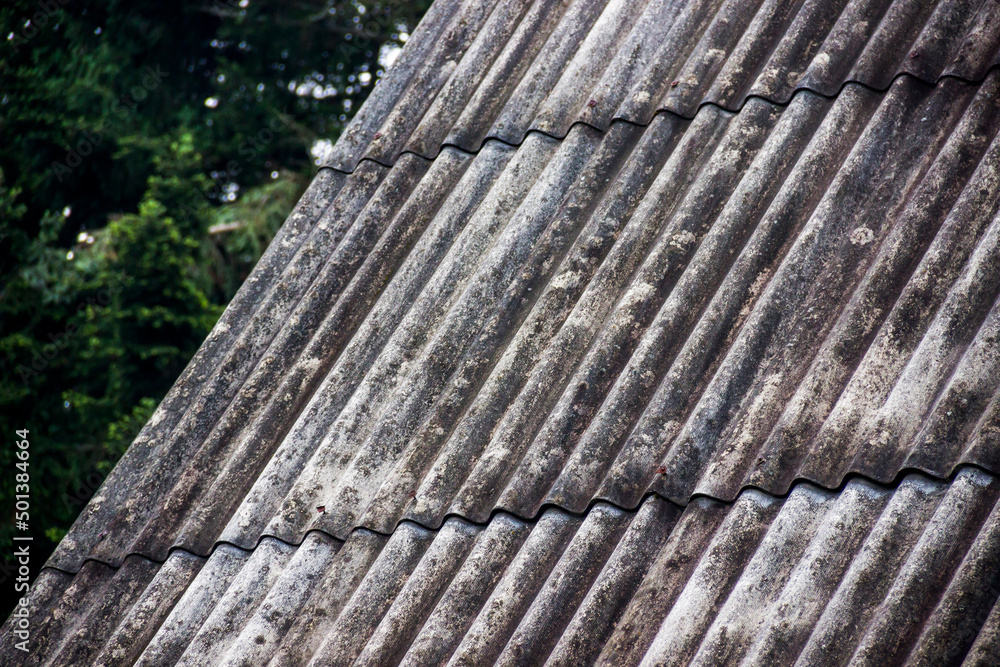 close-up of a wavy grey slate roof