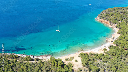 Aerial drone photo of paradise bay and turquoise beach of Dragonera covered in pine trees in small island of Agistri, Greece © aerial-drone