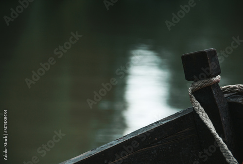 Boat trip on the river. Wooden boat close up. Wallpaper © Stasiuk