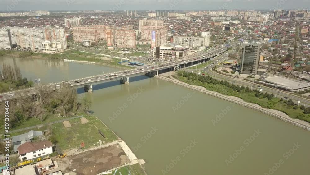 a group of modern high-rise residential buildings built on the site of small old factories on the banks of the Kuban River in the city of Krasnodar. Air view, D-cinelike format a group of modern high-rise residential buildings built on the site of small old factories on the banks of the Kuban River in the city of Krasnodar. Air view, D-cinelike format