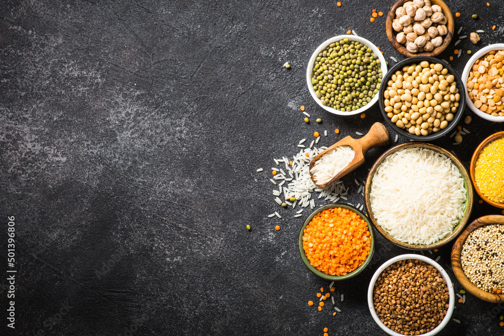 Gluten free food, cereals. Rice, buckwheat, corn, lentils, soy beans and quinoa at black. Allergen free. Top view with copy space. Gluten free food, cereals. Rice, buckwheat, corn, lentils, soy beans and quinoa at black. Allergen free. Top view with copy space.