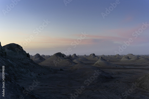 Beautiful view of yardang landform landscape during sunset photo