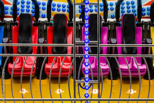 Seats of the 'Miami' ride at Kirtlington Feast funfair in England, the UK photo