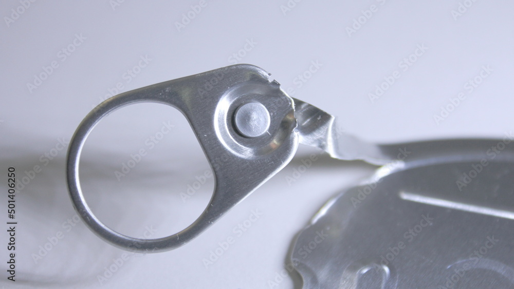 aluminum can lid that can be recycled on a white background. aluminum can lid that can be recycled on a white background.