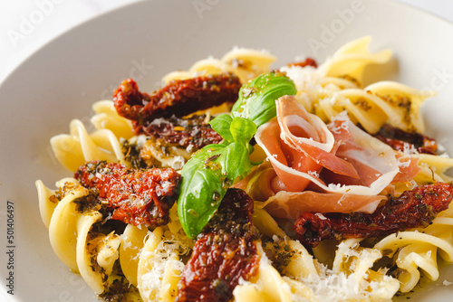 Pasta with Spanish jamon serrano, dried tomatoes 