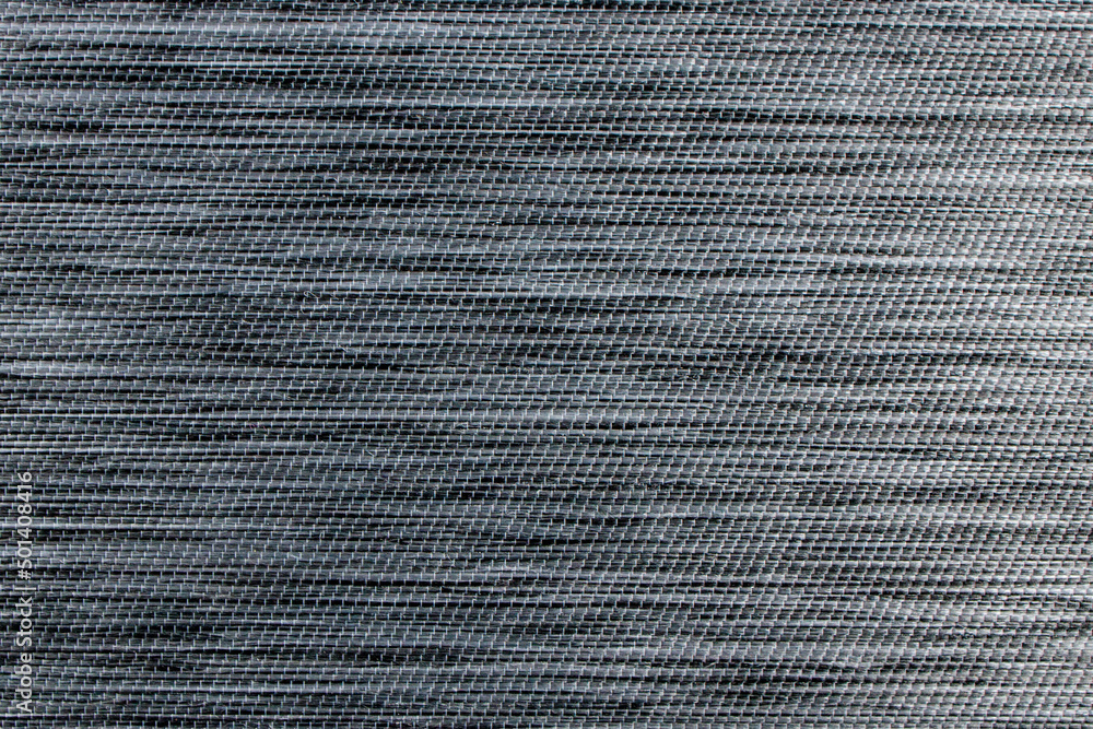 Gray fabric background from textile dense material with wicker pattern, close up. Fabric structure. Fabric background Gray fabric background from textile dense material with wicker pattern, close up. Fabric structure. Fabric background