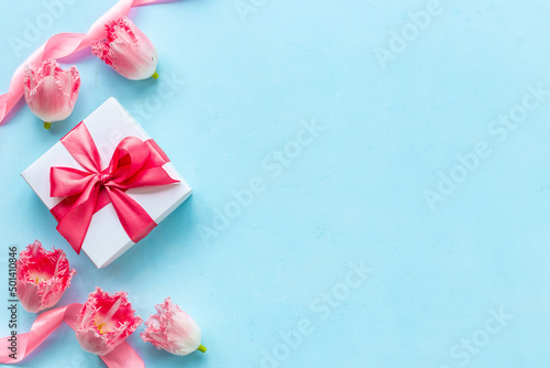 Fift box with pink ribbon. Women mothers day concept © 9dreamstudio