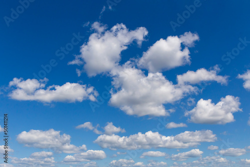 white fluffy clouds in a blue sky