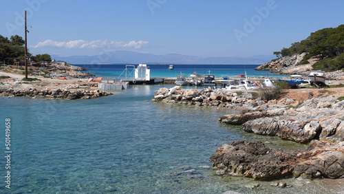 Paradise bay and small port with turquoise beach of Aponisos in island of Agistri, Saronic Gulf, Greece photo