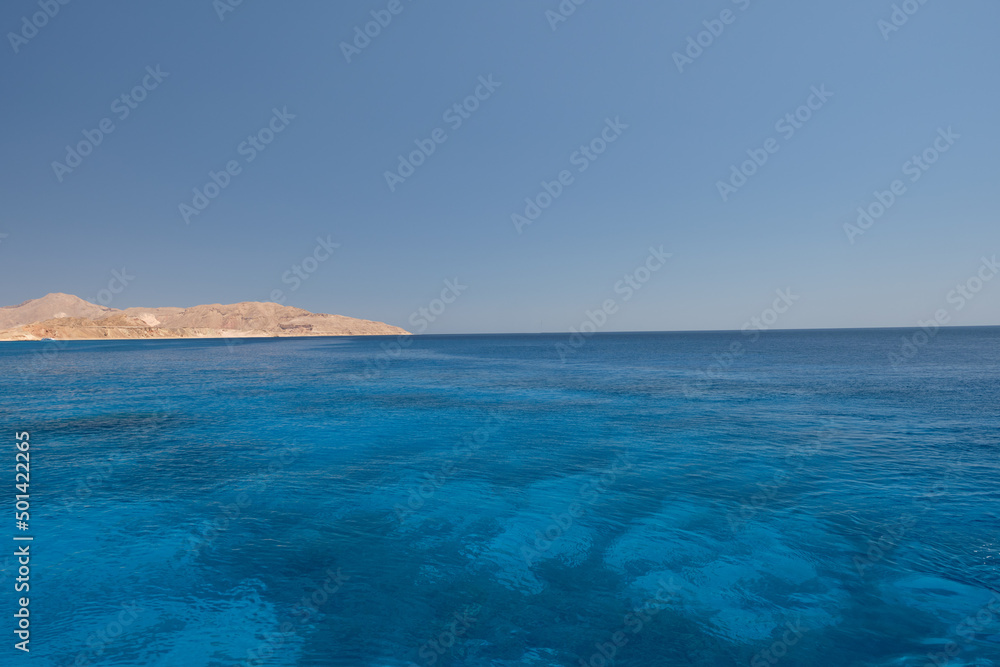 The coastline of the Red Sea and the mountains in the background