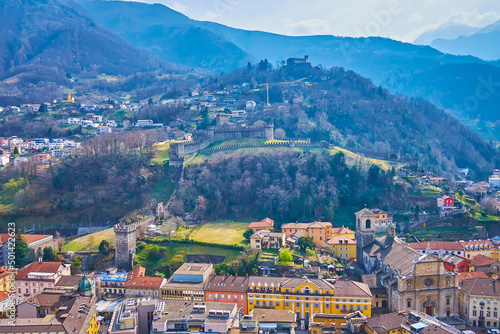 The old Bellinzona city with its Montebello and Sasso Corbaro fortresses on the hills, Switzerland photo