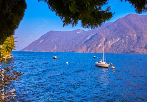 The scenic view on the yachts on Lugano Lake, Switzerland photo