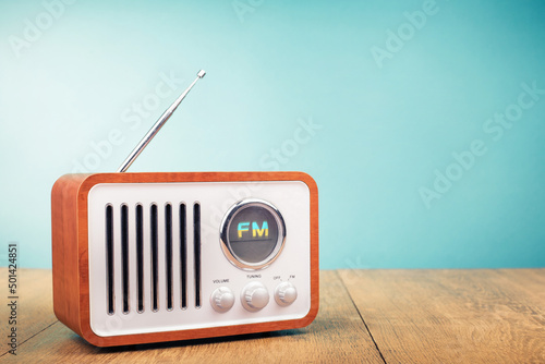 Retro old FM radio front mint blue background. Vintage style filtered photo photo
