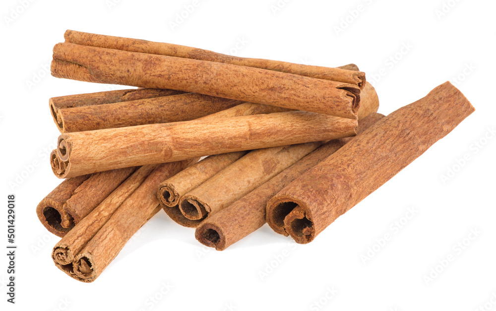 pile of spice cinnamon sticks isolated on white background pile of spice cinnamon sticks isolated on white background