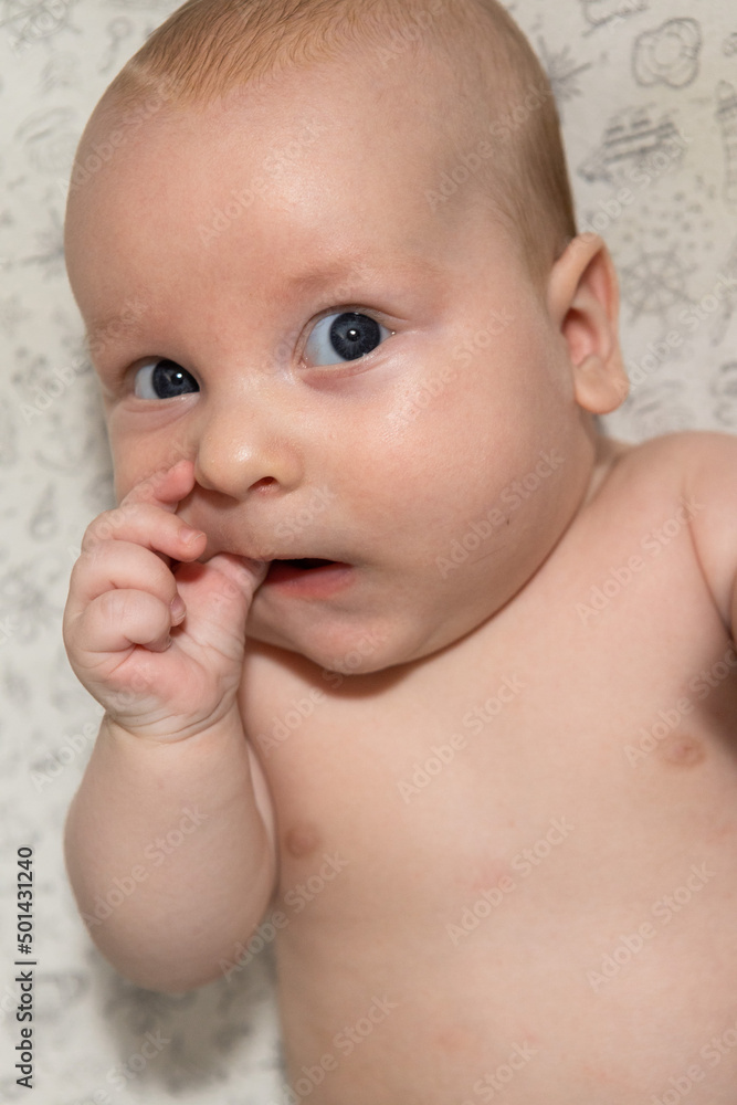 cute three month old baby eating his hand. Teething cute three month old baby eating his hand. Teething