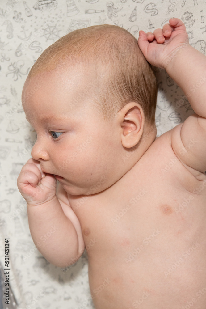 cute three month old baby eating his hand. Teething cute three month old baby eating his hand. Teething