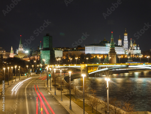 Moscow  Russia  Apr 13  2022  Night view of Prechistenskaya embankment and the Moscow Kremlin from Patriarshy bridge. Car traces.