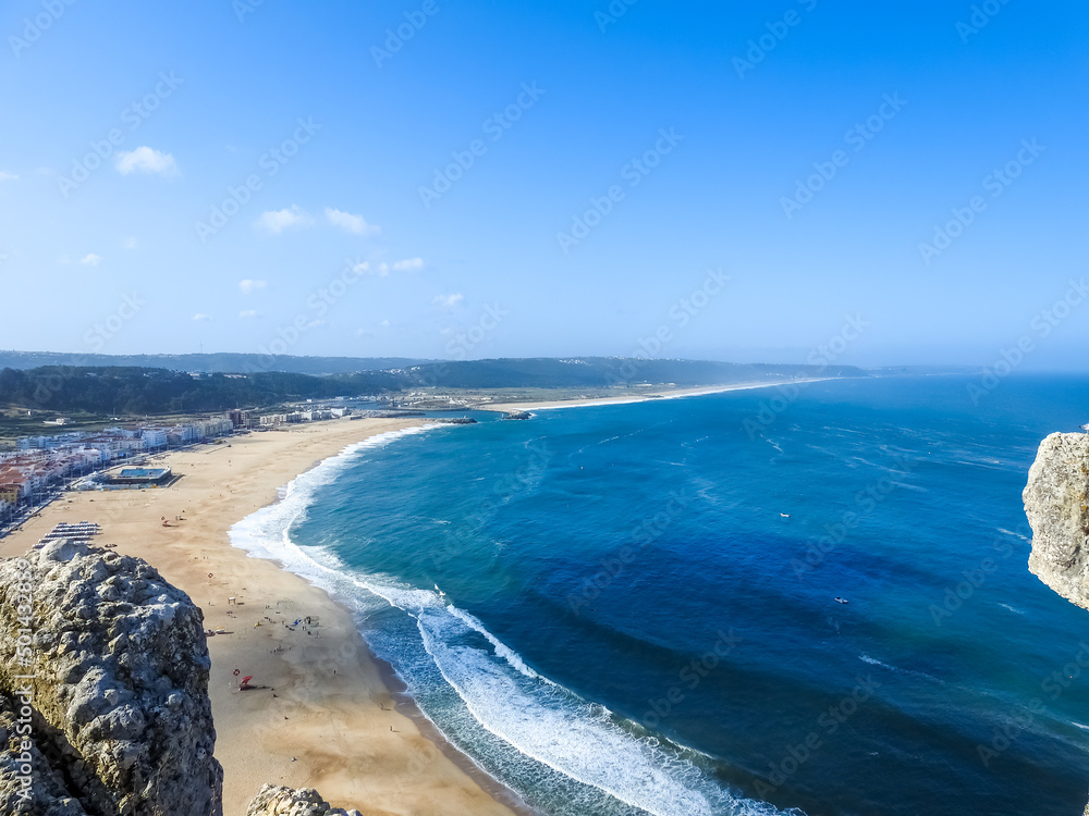 Beach landscape on a sunny day. Nazare, Portugal.
