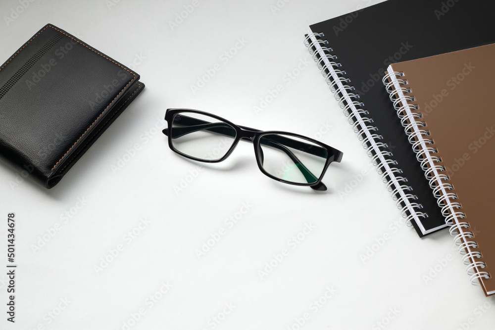 Stylish eyeglasses on white office desk. white work desk Stylish eyeglasses on white office desk. white work desk