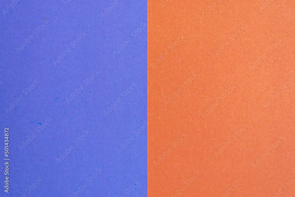 Fototapeta premium colored pieces of paper blue and orange symmetry