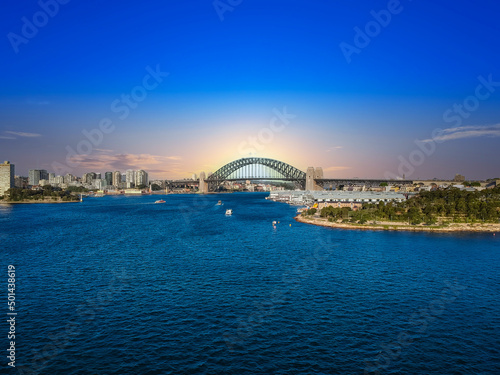 Sydney Harbour Australia with nice colours in the sky. Nice blue water of the Harbour, high rise offices and residential buildings of the City in the background, NSW Australia