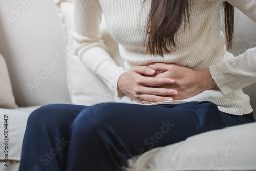 woman have stomach pain from menstruation. photo