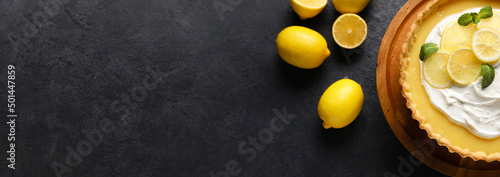 Foto Delicious lemon tart on dark background with space for text