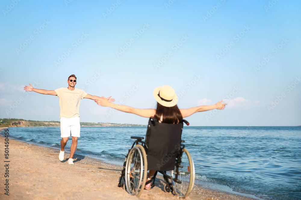 Happy woman with physical disability and her boyfriend at sea resort Happy woman with physical disability and her boyfriend at sea resort