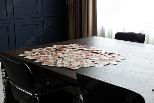Russian rubles, cash are on the table in the office. 5000 rubles