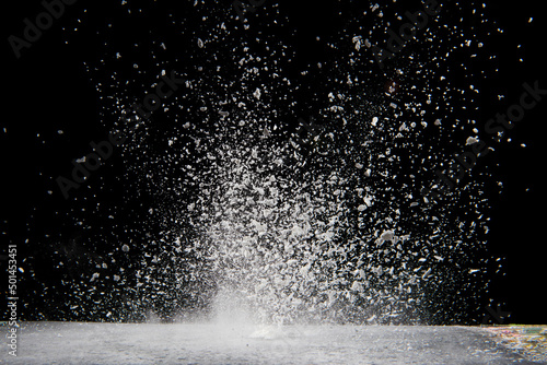 Fototapeta Naklejka Na Ścianę i Meble -  Explosion of white powder isolated on black background. 