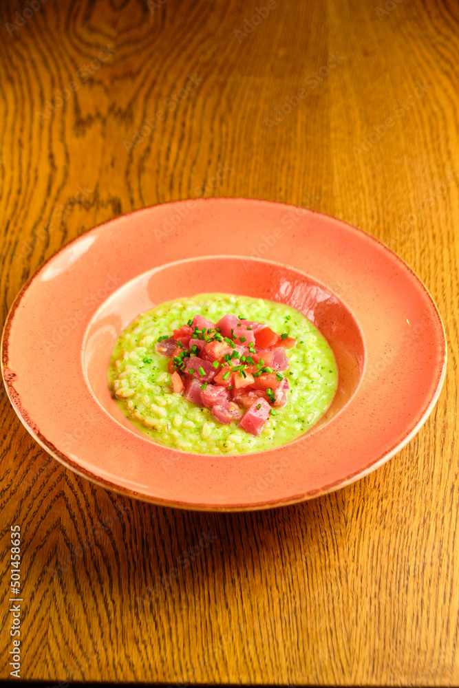 Green Risotto on a white restaurant plate. Green Risotto on a white restaurant plate.
