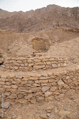 circular tombs with domes in Arabian desert build with rocks photo