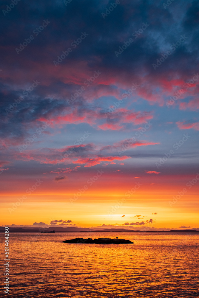  A setting sun makes for beautiful island silhouettes in the foreground and colorful skies above