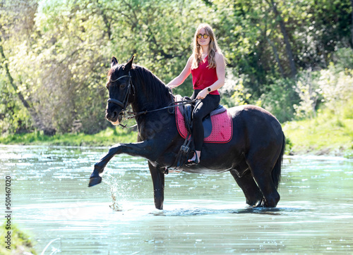 riding girl and horse in river © cynoclub