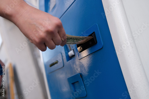 Replenishment of dollars in cash at ATM money in hand photo