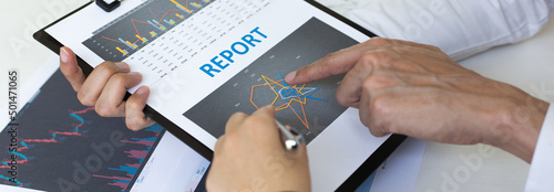 Accountants and financiers are brainstorming the analysis of revenue performance with stock graphs at meetings, Analysis of real estate investment and income tax data concept.