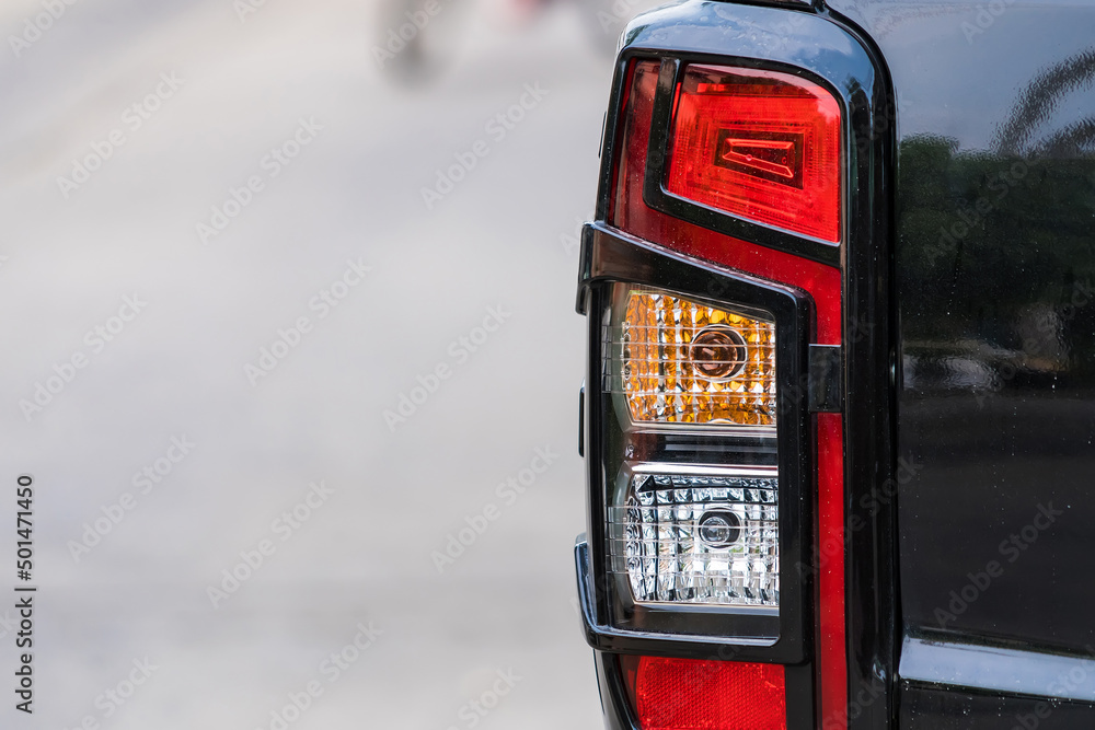 Close-up view of a right side car tail light lamp mounted on the back Close-up view of a right side car tail light lamp mounted on the back